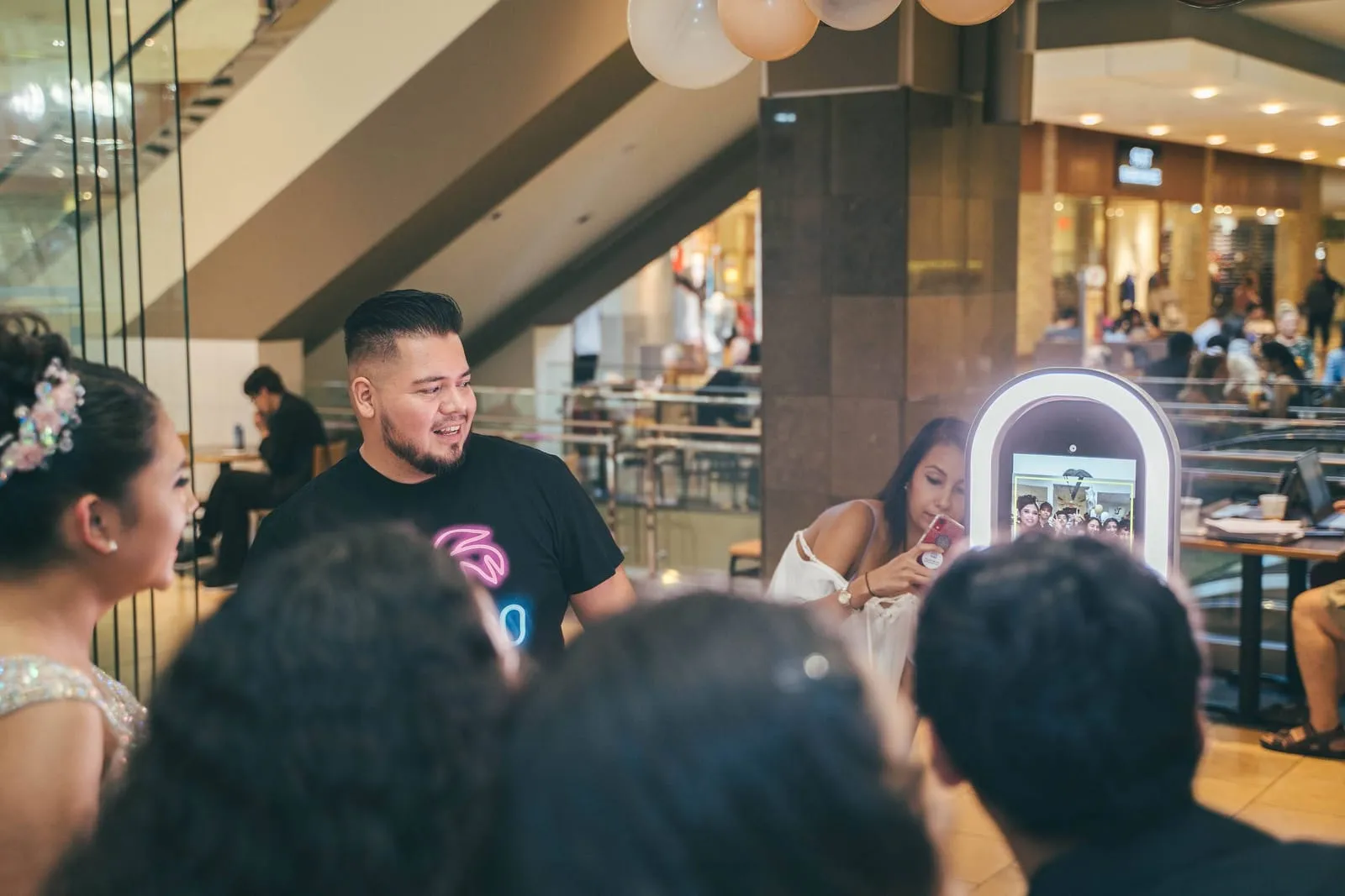 Guests posing together at a QuickSnap photo booth