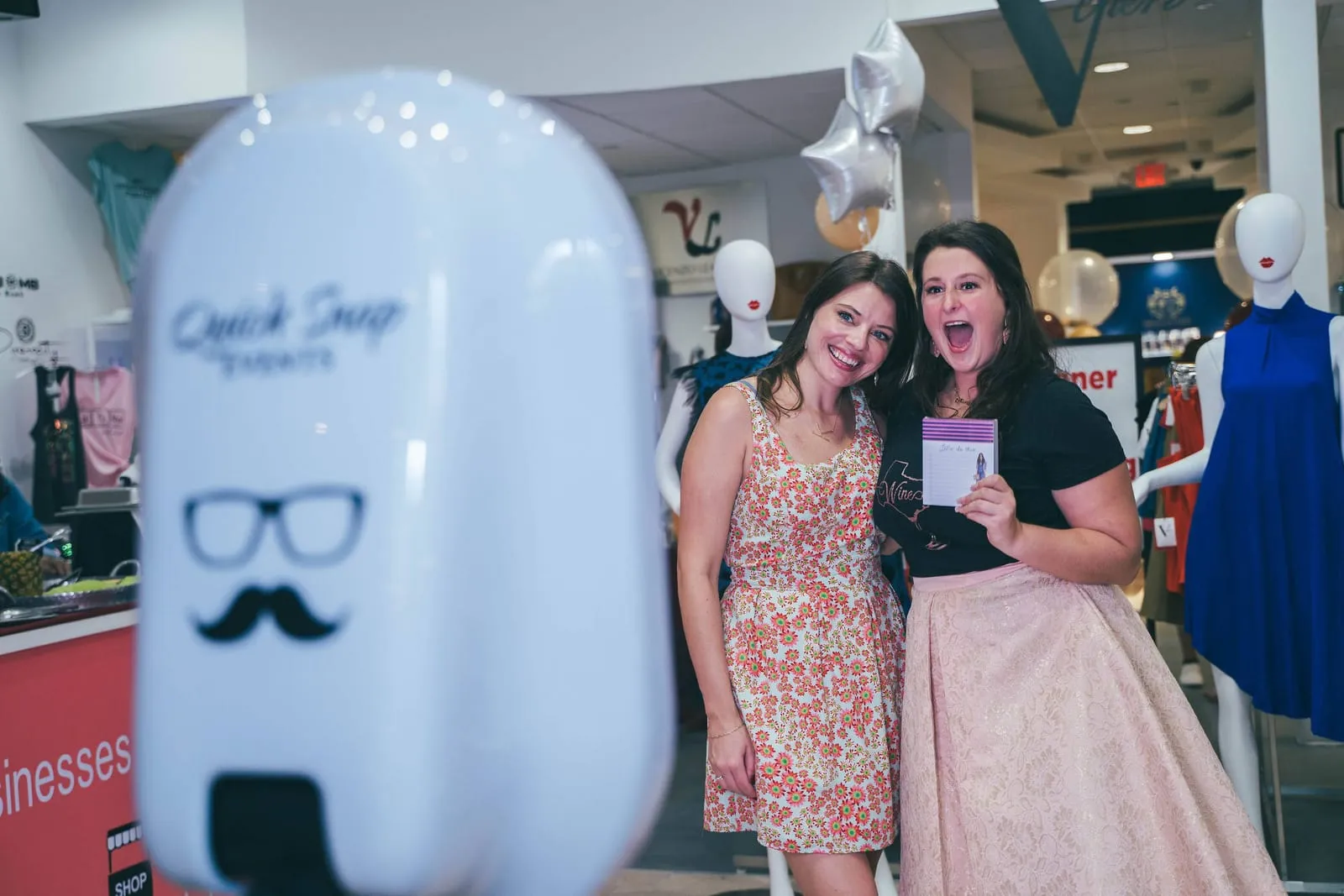 Group celebrating at a QuickSnap photo booth